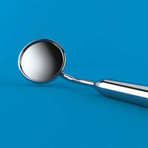 a small dentist's mirror tool with a seamless blur background.